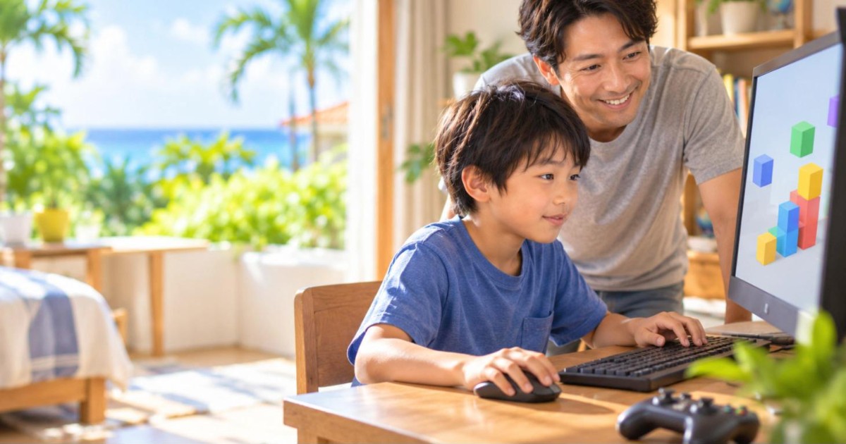 パソコンでゲーム作りに集中する小学生の男の子と、後ろから見守る父親